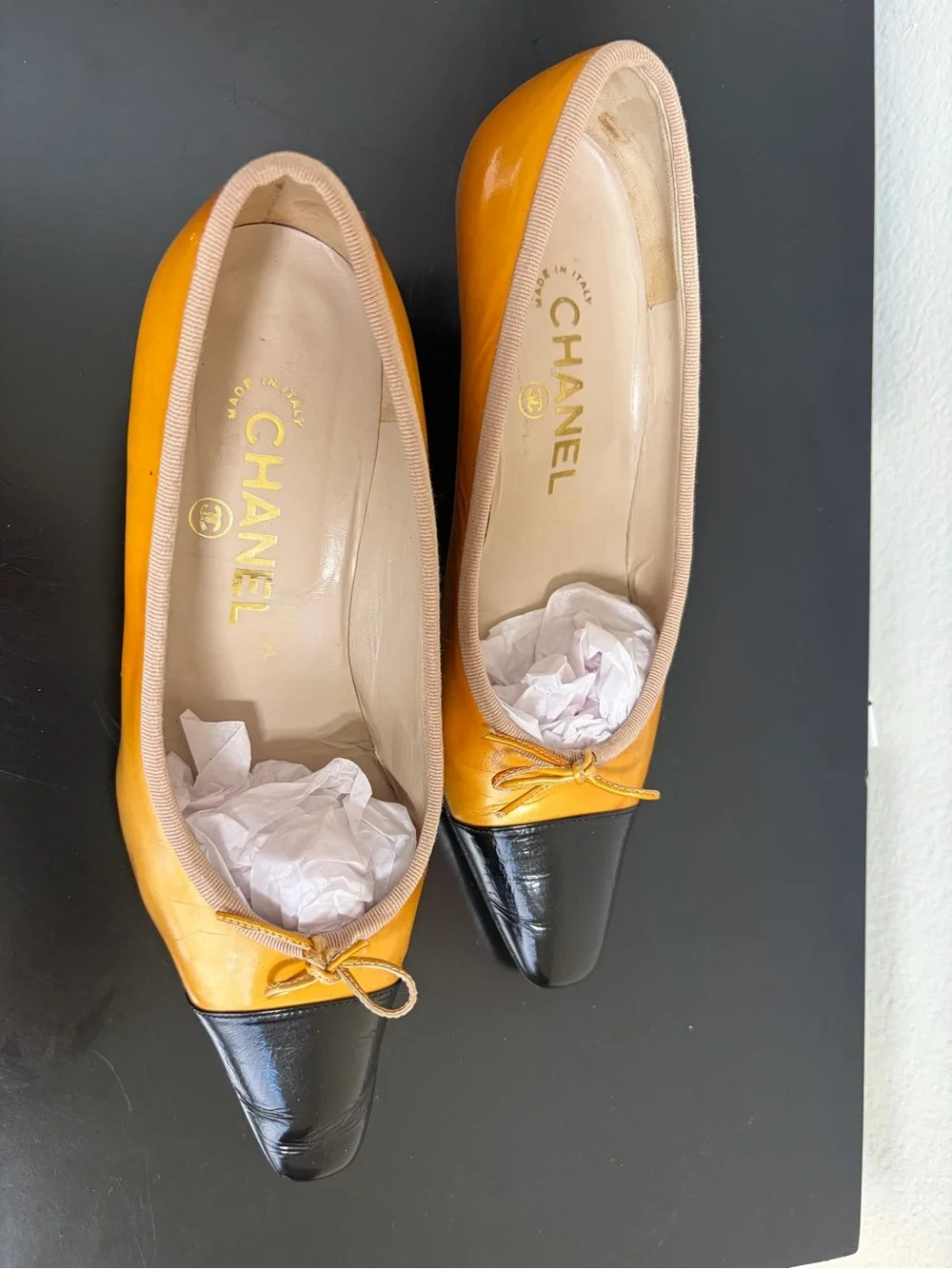 CHANEL Two-Tone Yellow and Black Leather Cap-Toe Ballet Flats